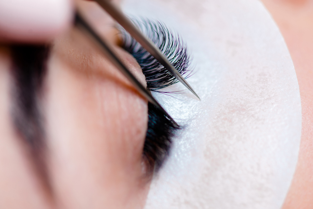 Eyelash Extension Procedure. Woman Eye with Long Eyelashes. Lashes, Close up, Macro, Selective Focus.